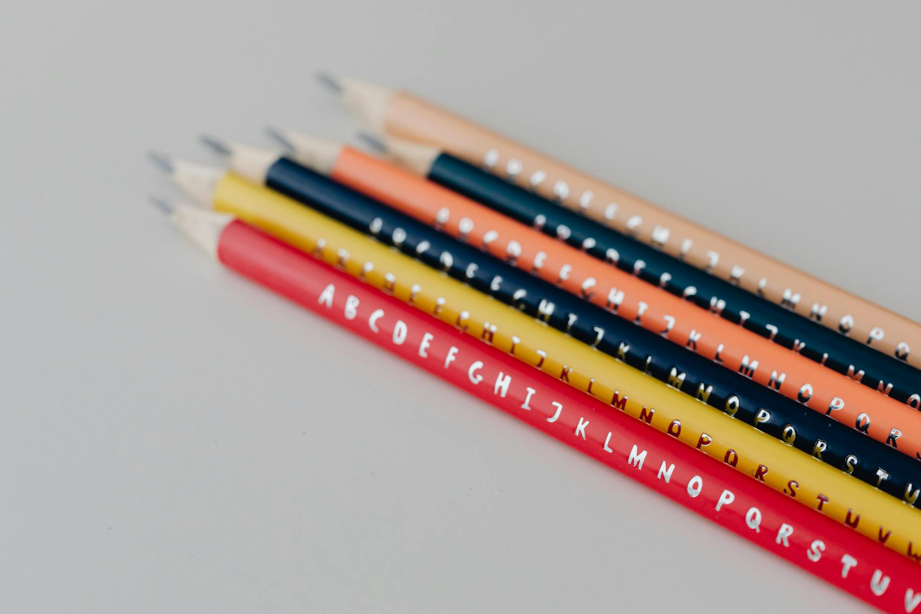 close up shot of colored pencils on a white surface